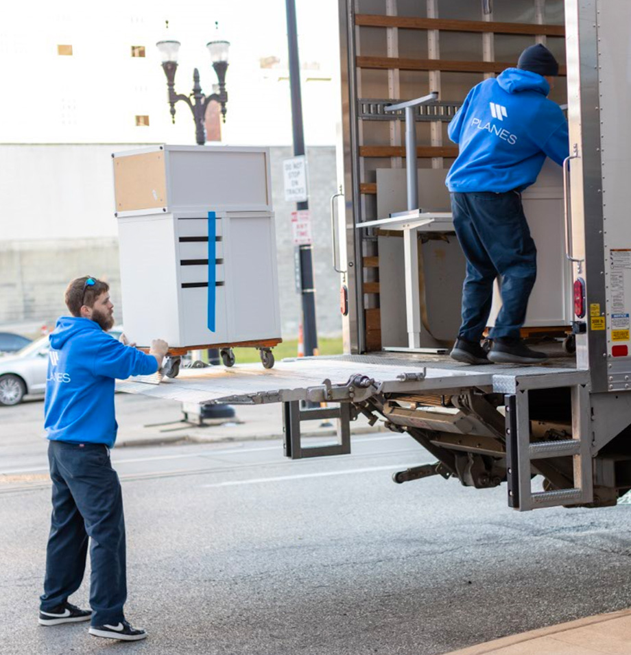 Planes loading office furniture onto moving truck
