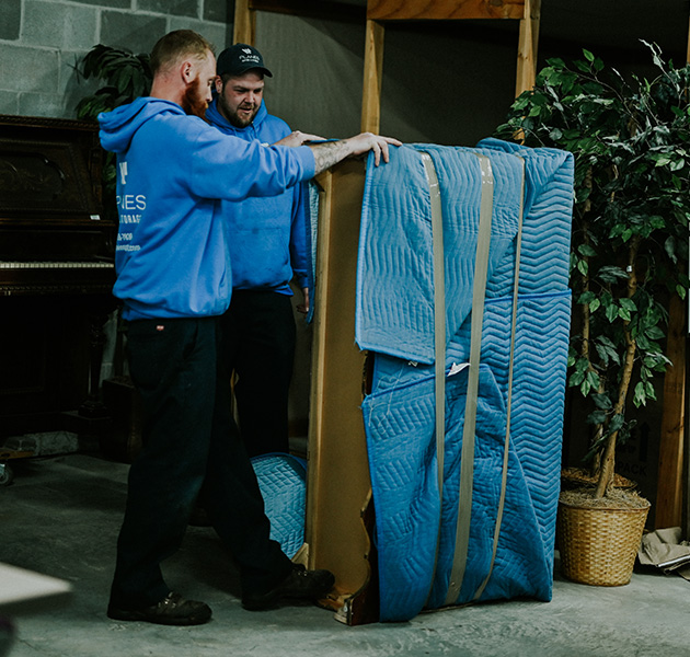 planes movers moving a couch