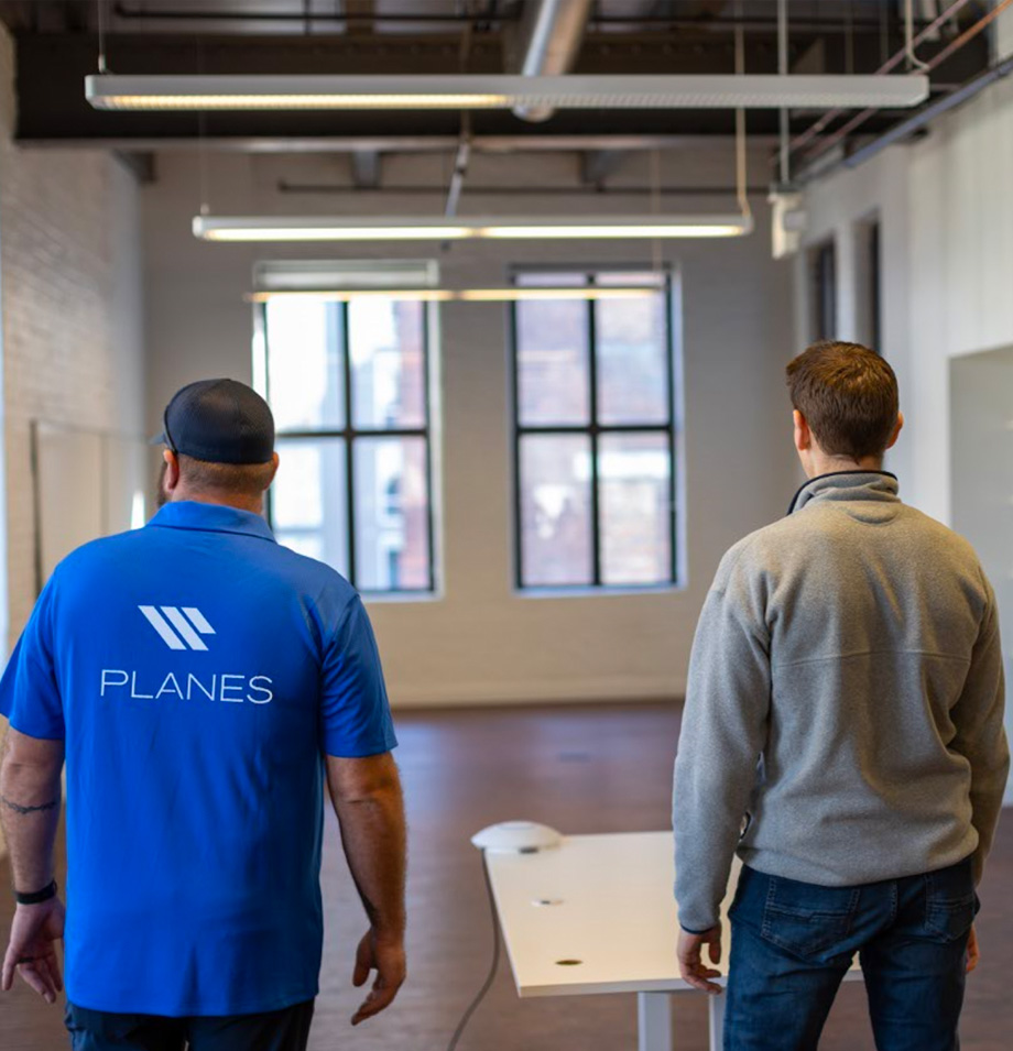 Planes employees placing furniture