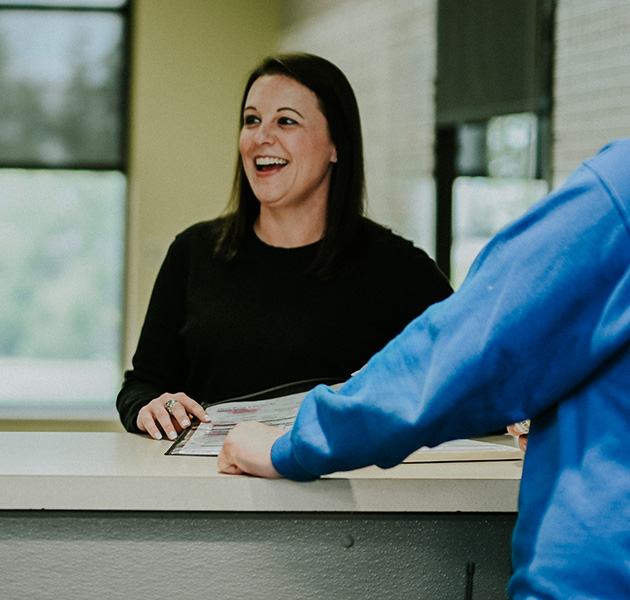 Planes employee laughing with coworker