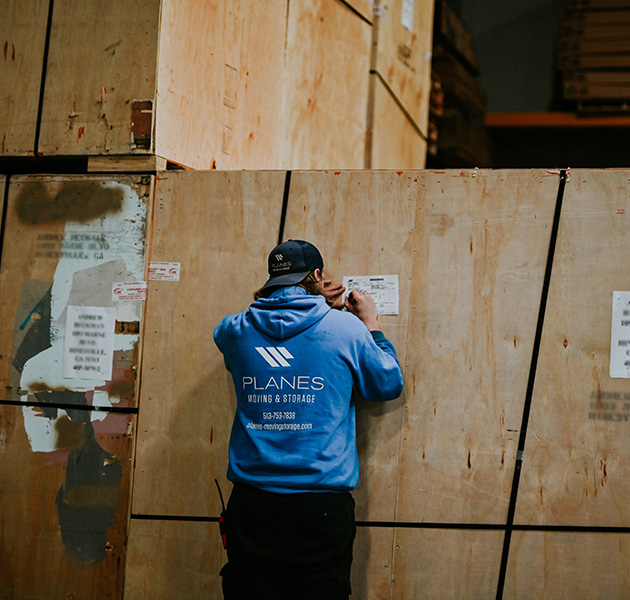 Planes employee filing our a warehouse form