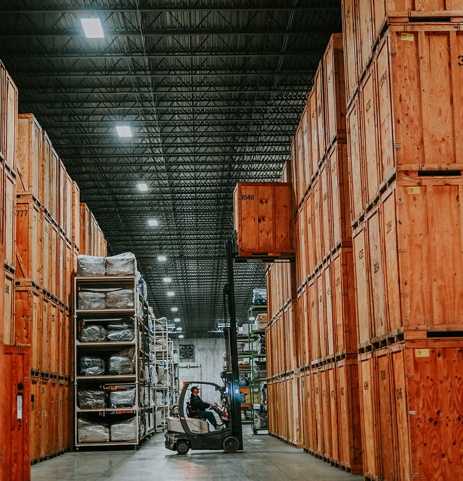 Forklift removing a storage crate