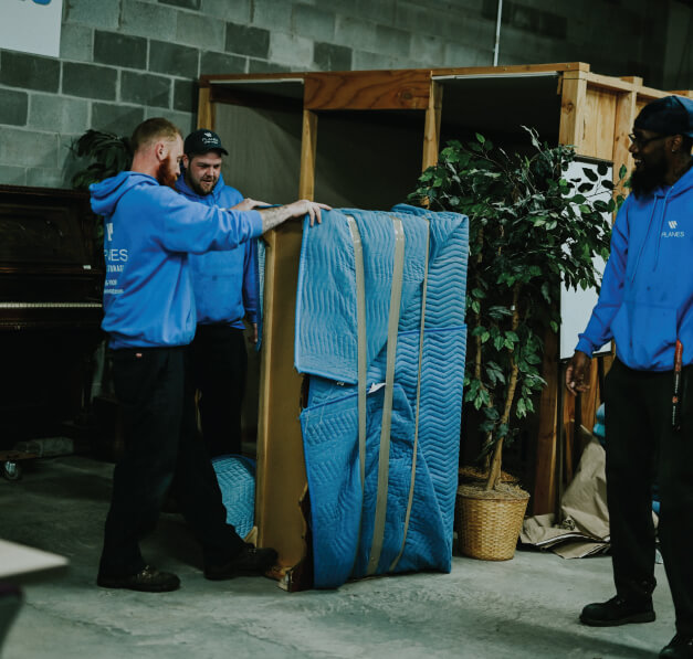 Planes employees moving dresser